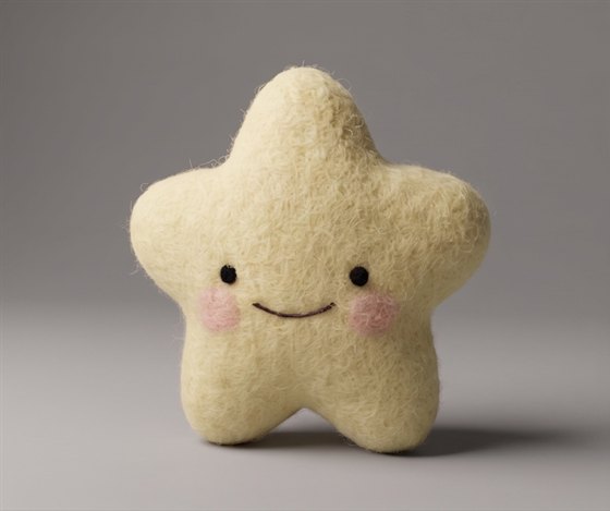 Star, a butter-yellow felted star with rosy cheeks
